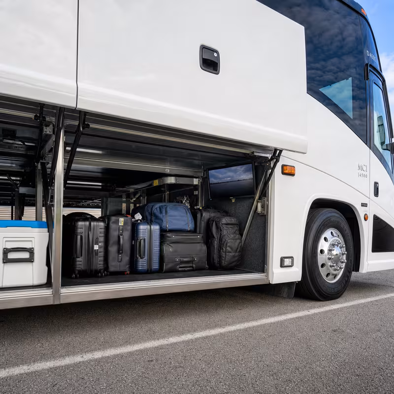 Party bus interior with wraparound leather seating and LED lighting in Dallas