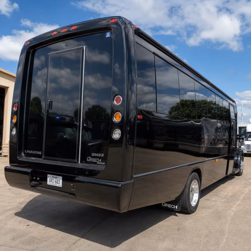 Party bus interior with wraparound leather seating and LED lighting in Dallas
