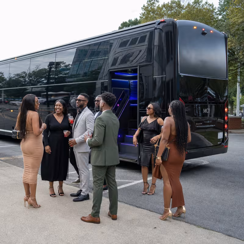 Passengers loading luggage while boarding an Dallas group shuttle