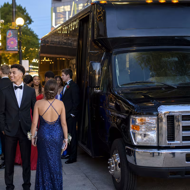 Passengers loading luggage while boarding an Dallas group shuttle
