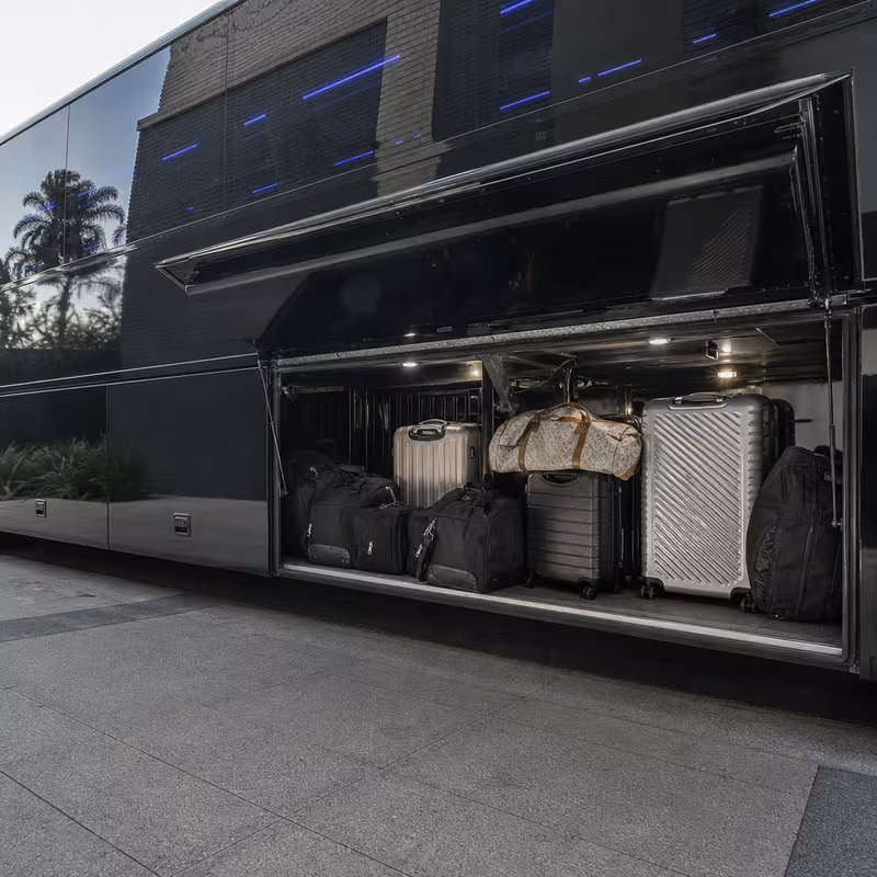 Party bus interior with wraparound leather seating and LED lighting in Dallas