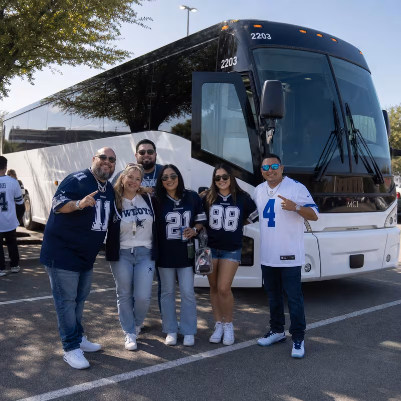 Passengers loading luggage while boarding an Dallas group shuttle