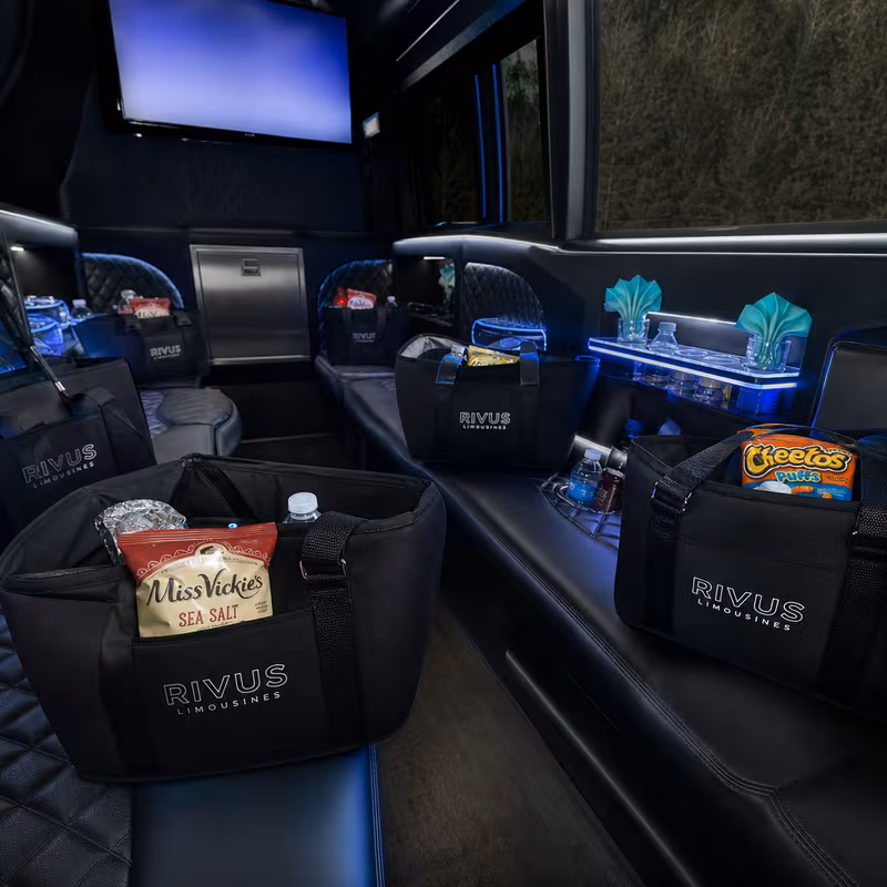 Party bus interior with wraparound leather seating and LED lighting in Dallas
